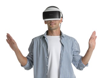 Smiling man using virtual reality headset on white background