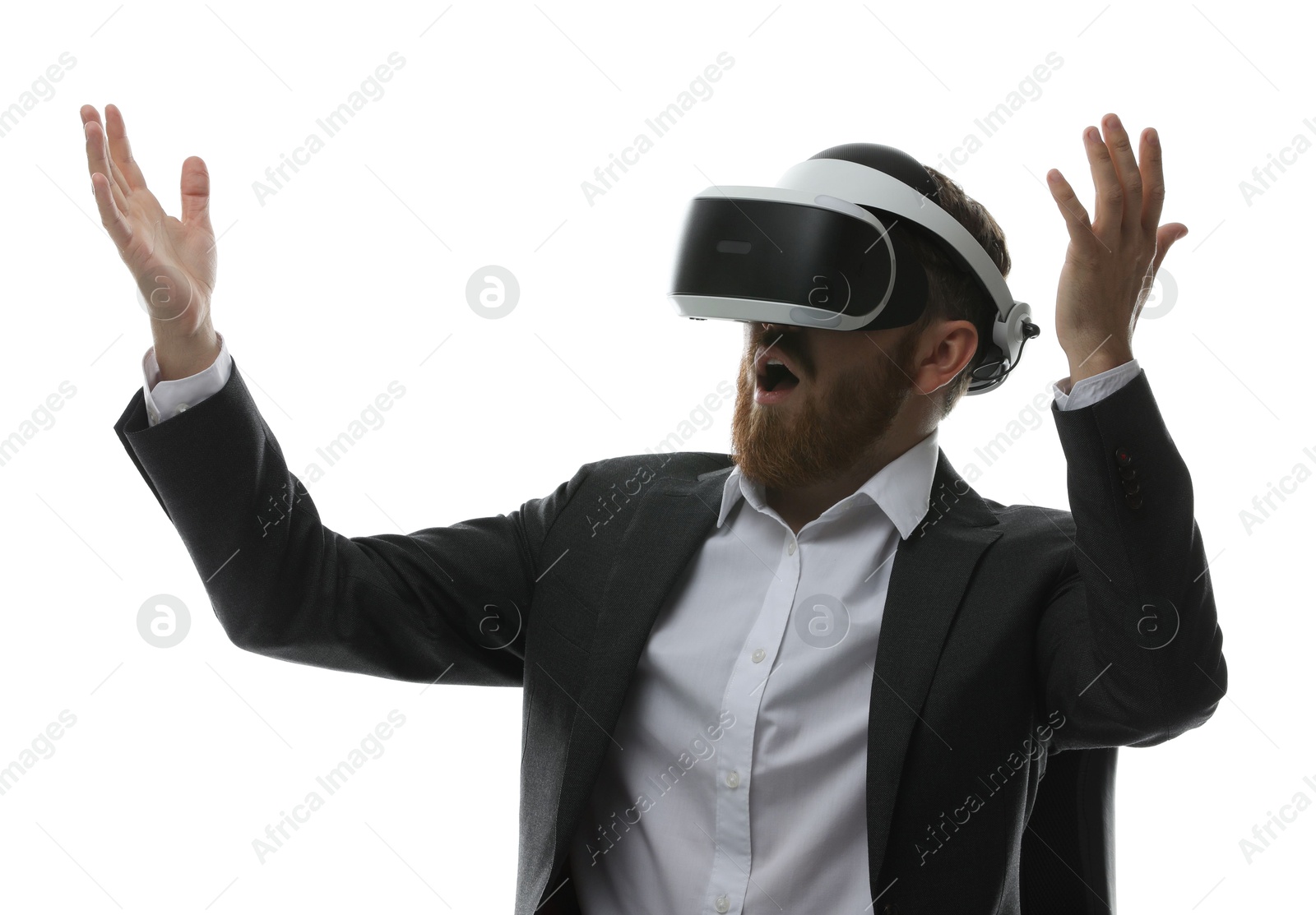 Photo of Emotional man using virtual reality headset while sitting in office chair on white background