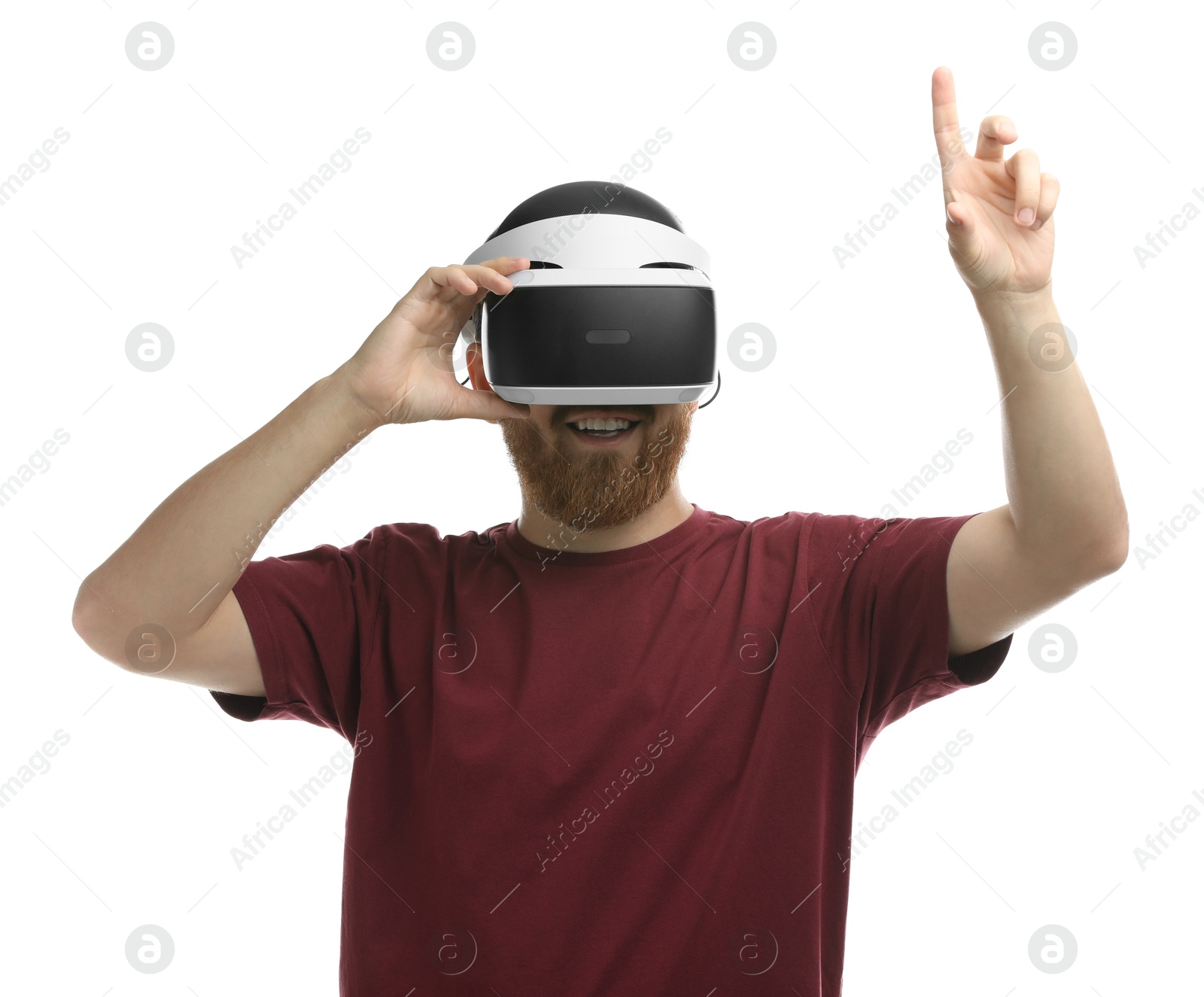 Photo of Smiling man using virtual reality headset on white background