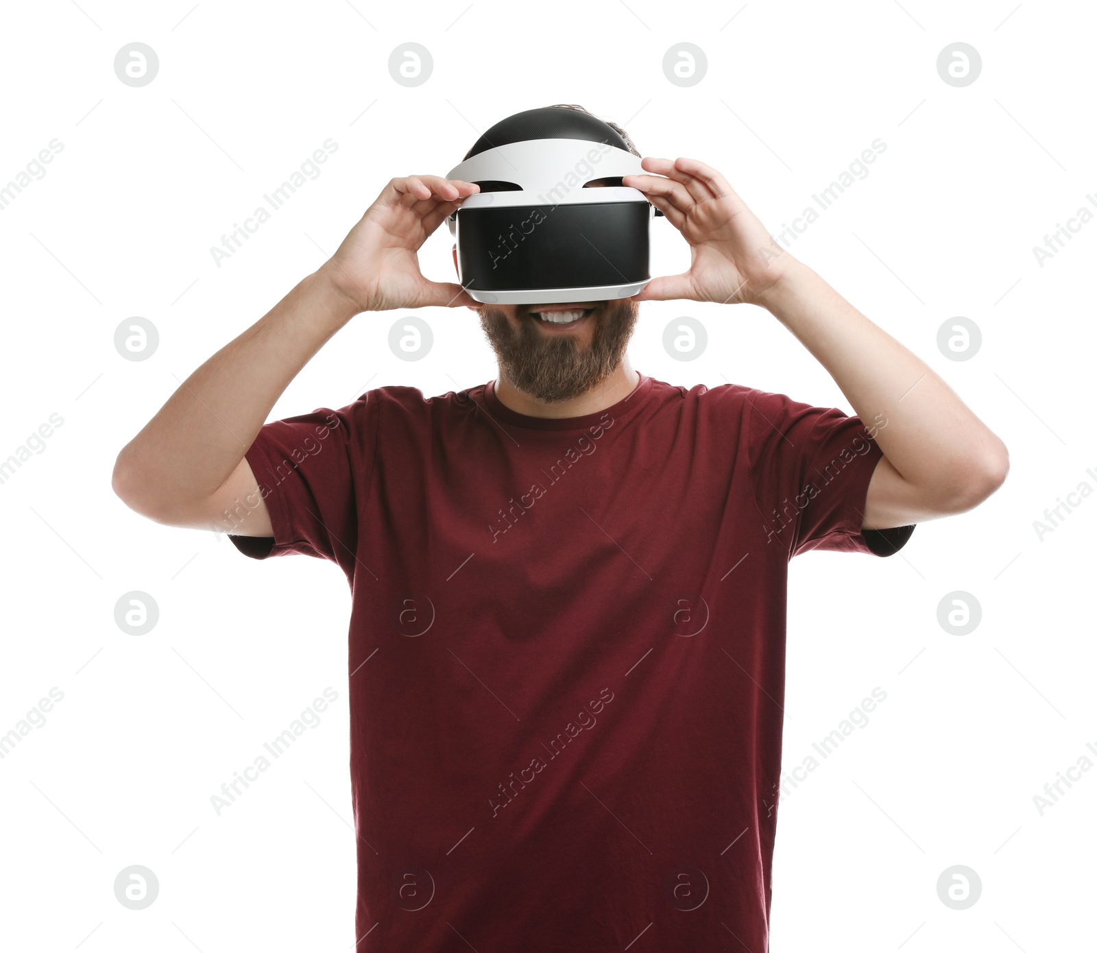 Photo of Smiling man using virtual reality headset on white background