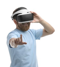 Smiling man using virtual reality headset on white background