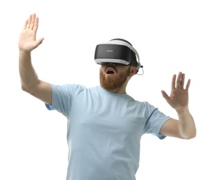 Emotional man using virtual reality headset on white background