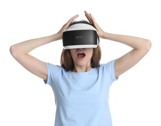 Emotional woman using virtual reality headset on white background