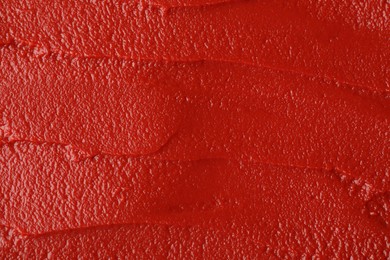 Texture of ketchup as background, top view. Tomato sauce