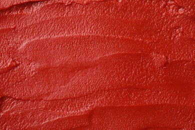 Photo of Texture of ketchup as background, top view. Tomato sauce