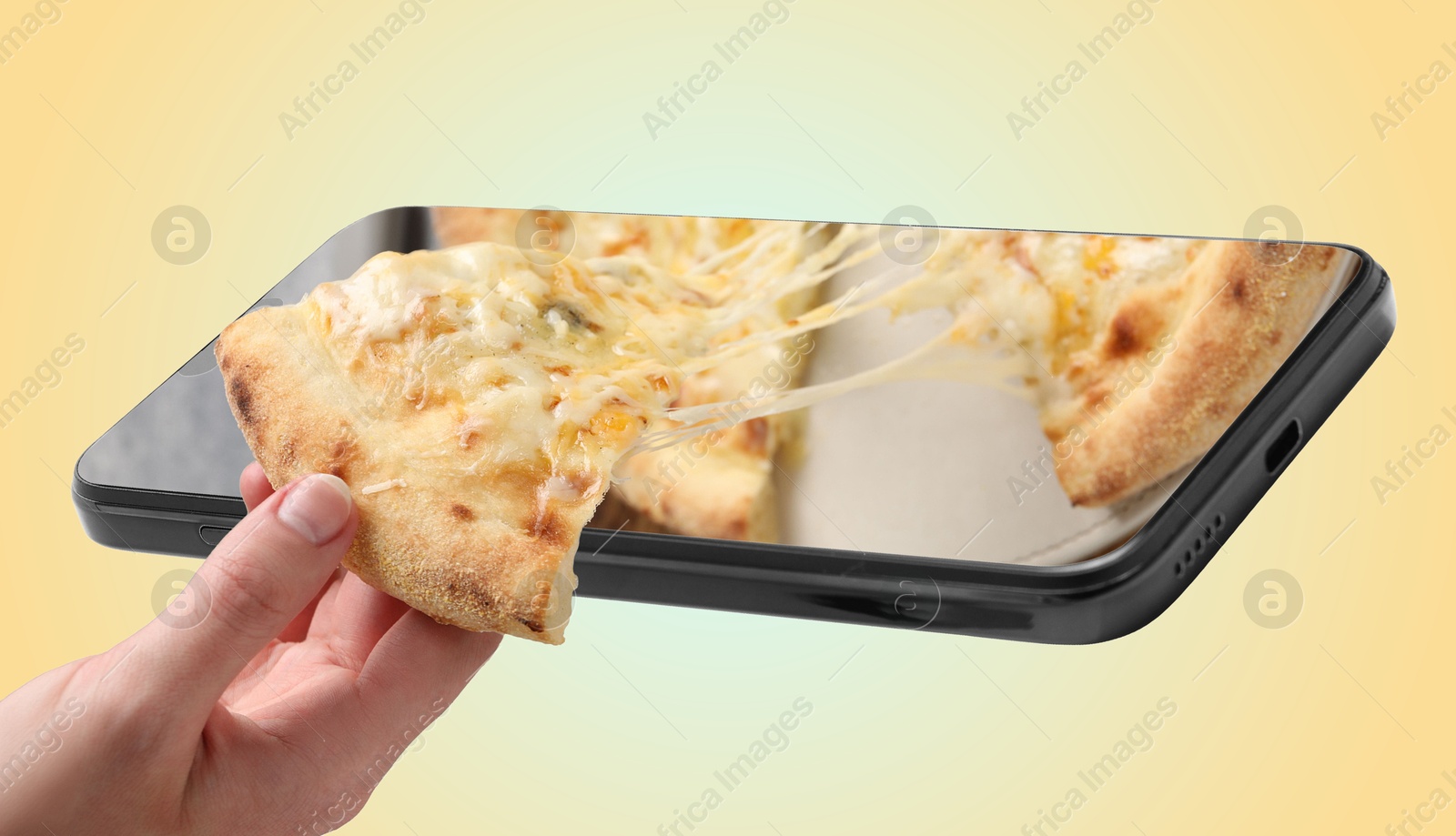 Image of Online food ordering. Woman taking slice of pizza from smartphone screen against yellow gradient background, closeup