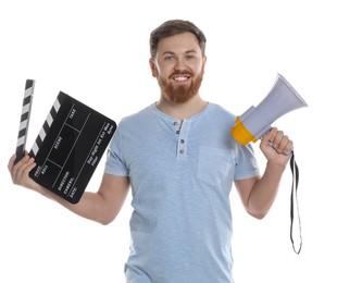 Making movie. Happy man with clapperboard and megaphone on white background
