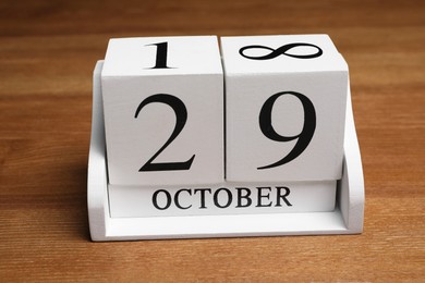 Photo of International Psoriasis Day - 29th of October. Block calendar on wooden table