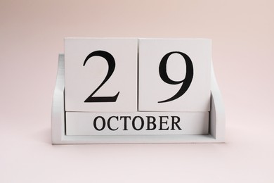 International Psoriasis Day - 29th of October. Block calendar on beige background