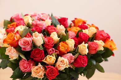 Bouquet of beautiful roses on light background