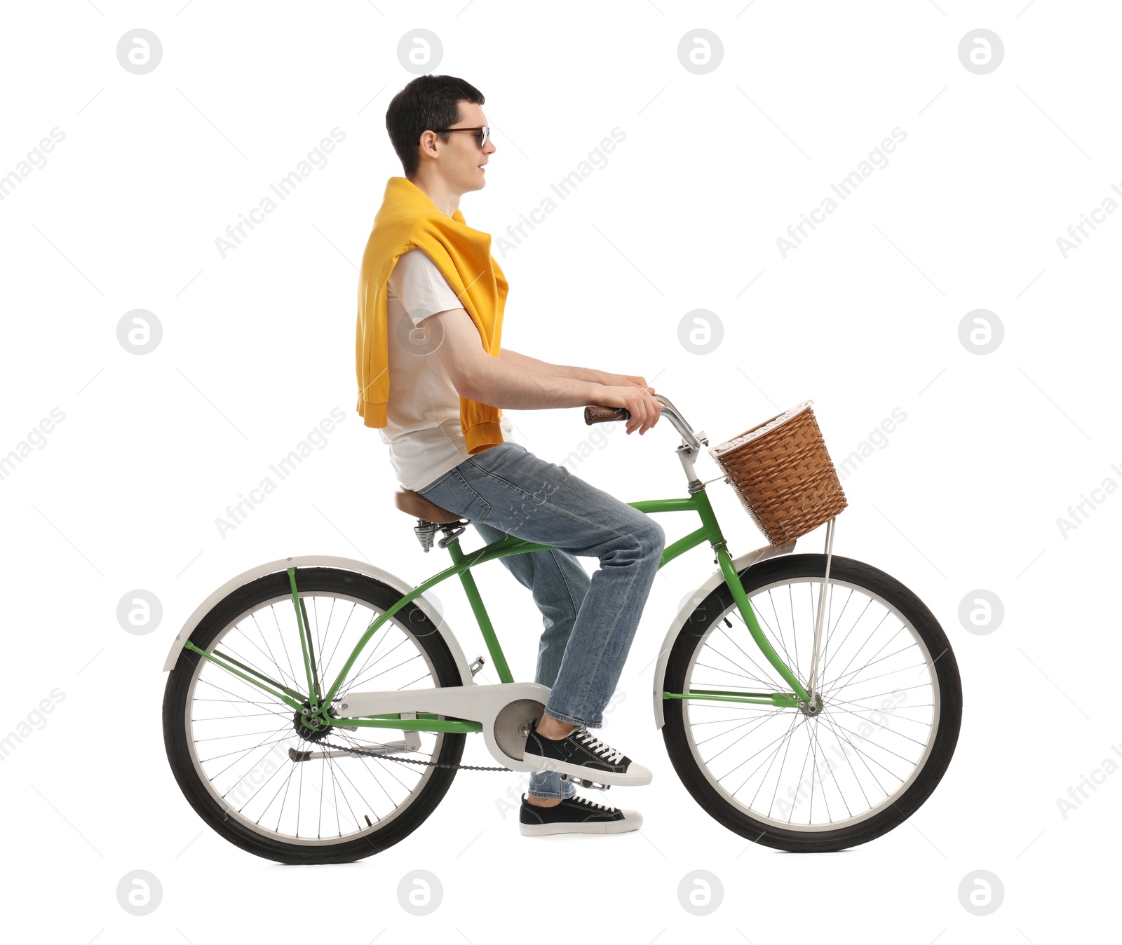 Photo of Man in sunglasses riding bicycle with basket on white background