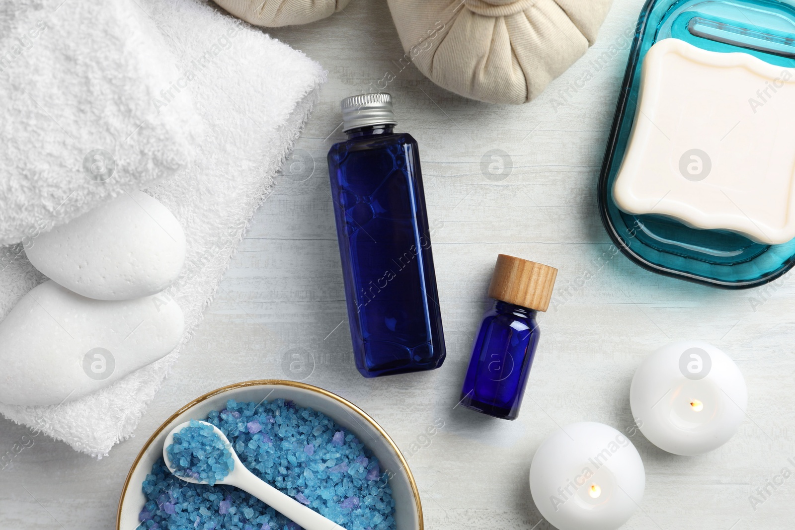 Photo of Flat lay composition with spa products on light wooden table