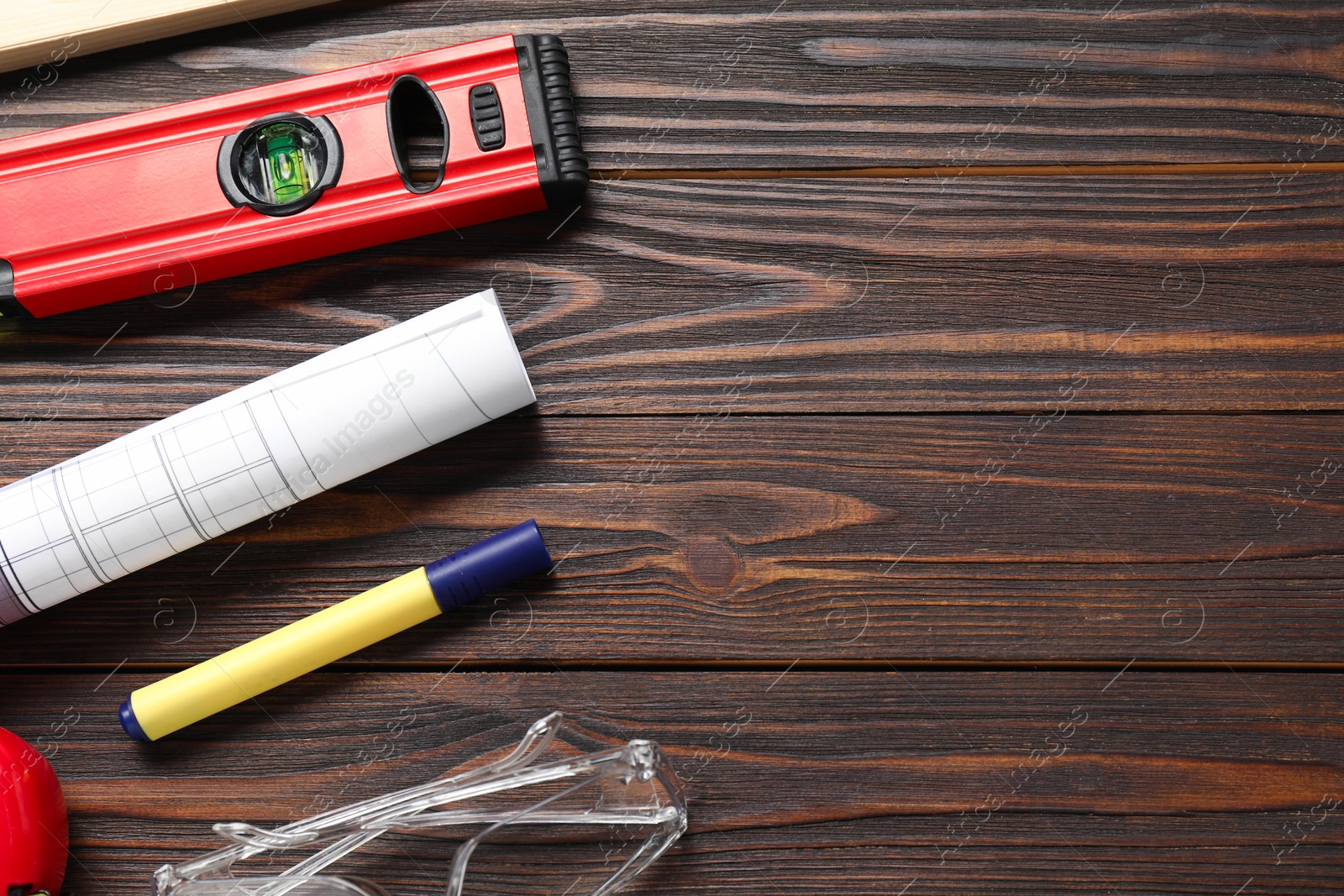 Photo of Flat lay composition with building level and other construction tools on wooden table, space for text