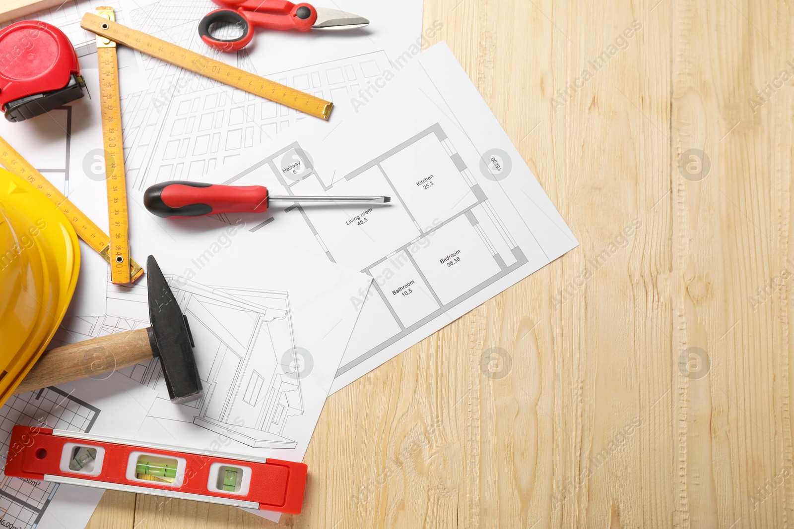 Photo of Flat lay composition with building level and other different construction tools on wooden background, space for text