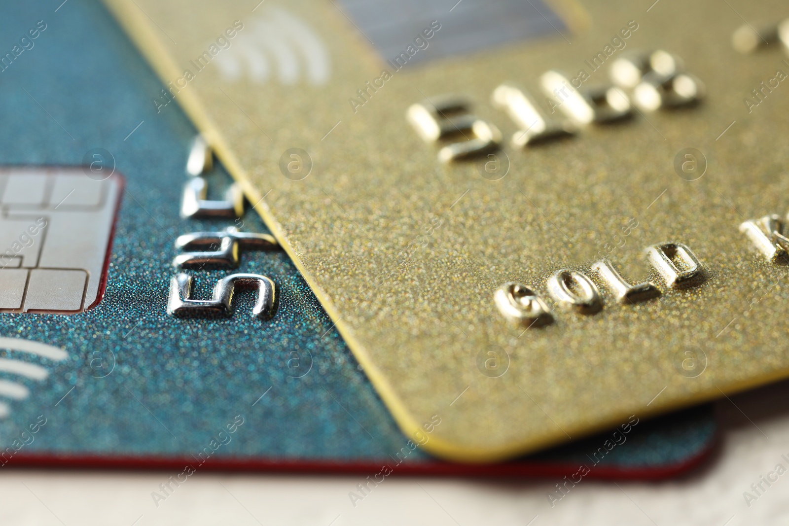 Photo of Two plastic credit cards on table, macro view