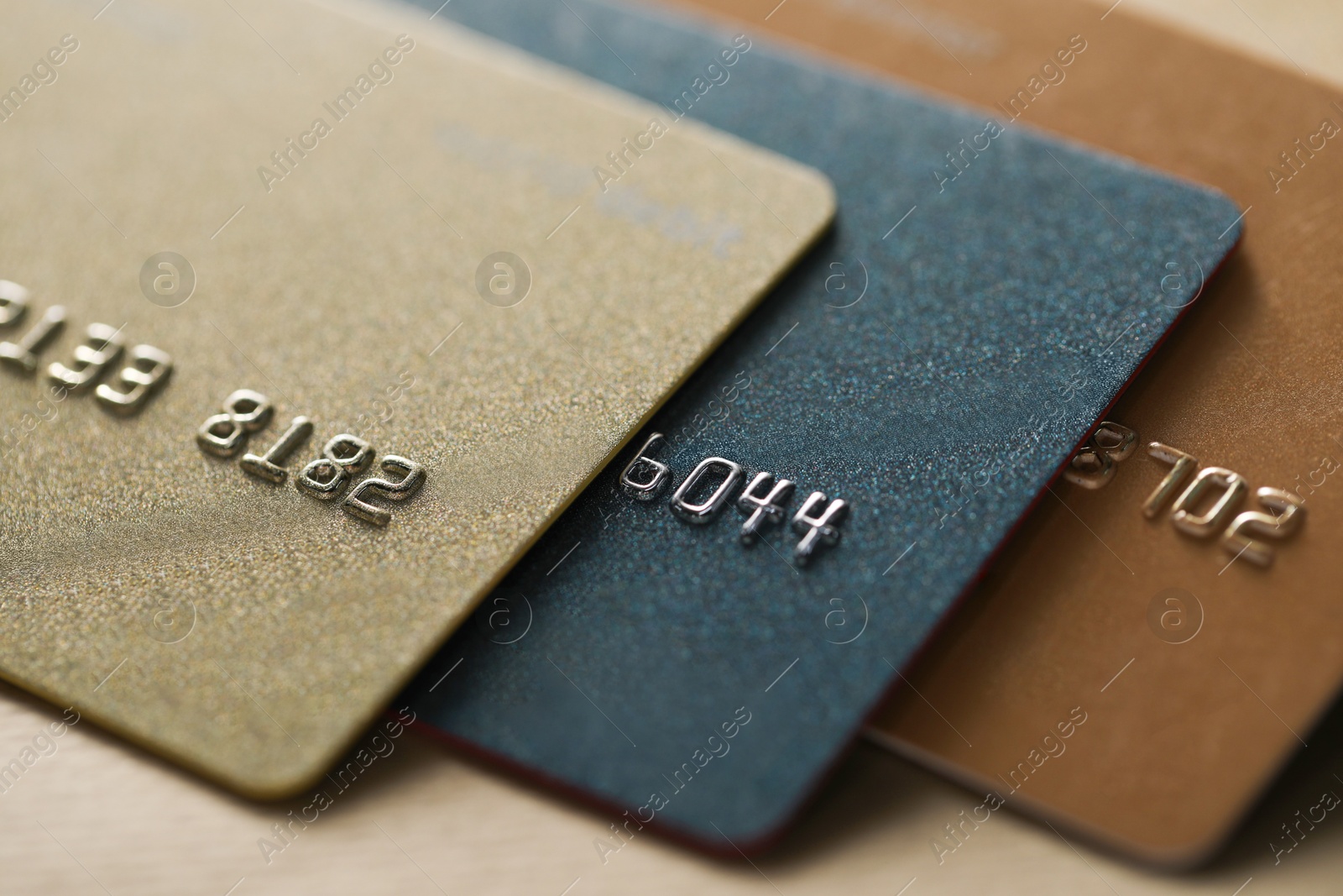 Photo of Many credit cards on table, closeup view