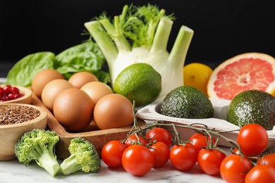 Many different healthy food on light table, closeup