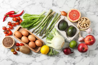 Photo of Many different healthy food on light marble table, flat lay