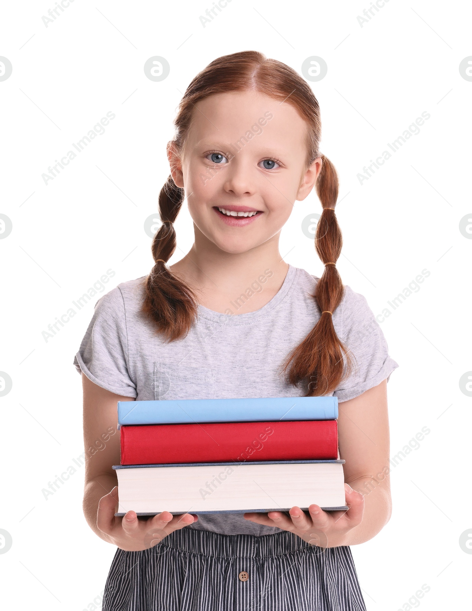 Photo of Smiling girl with stack of books on white background