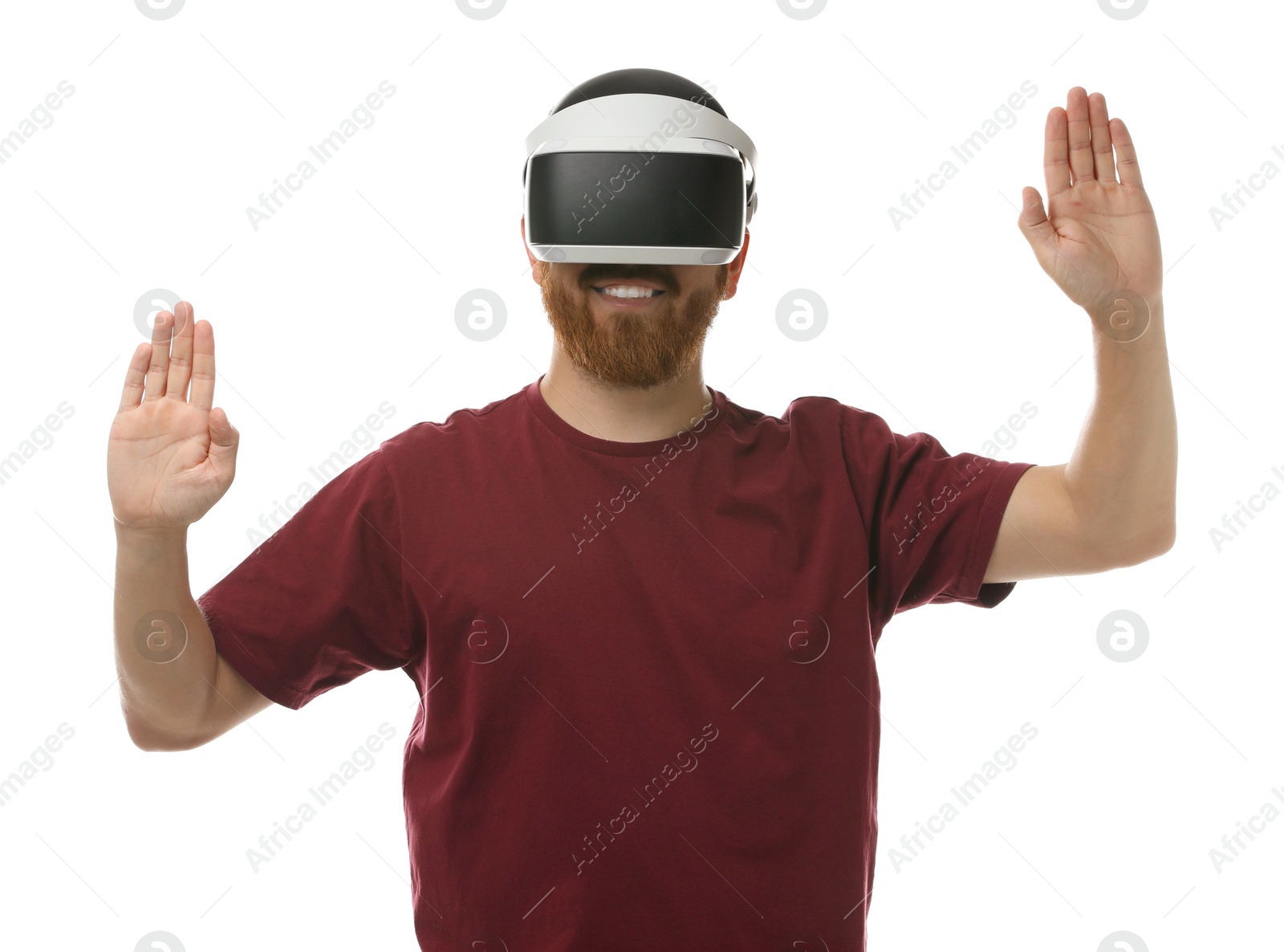 Photo of Smiling man using virtual reality headset on white background