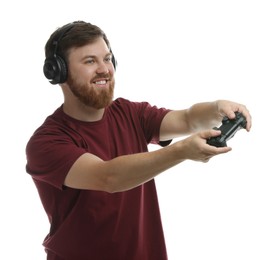 Photo of Happy man in headphones playing video game with controller on white background