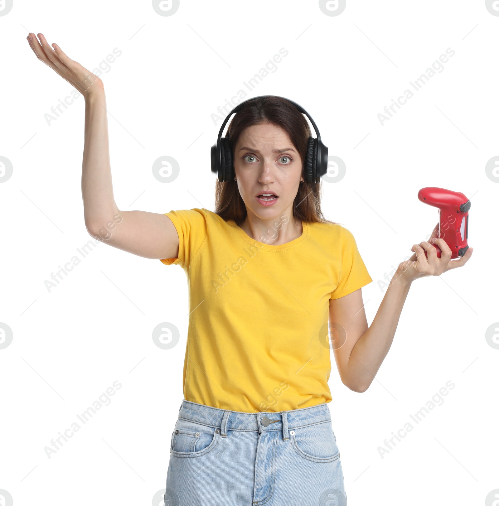 Photo of Confused woman in headphones with game controller on white background