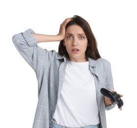 Photo of Confused woman with game controller on white background