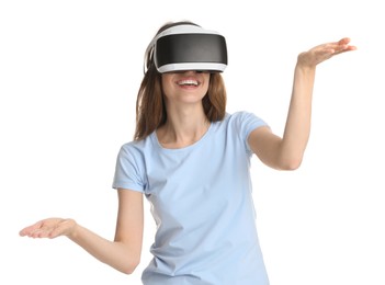 Smiling woman using virtual reality headset on white background