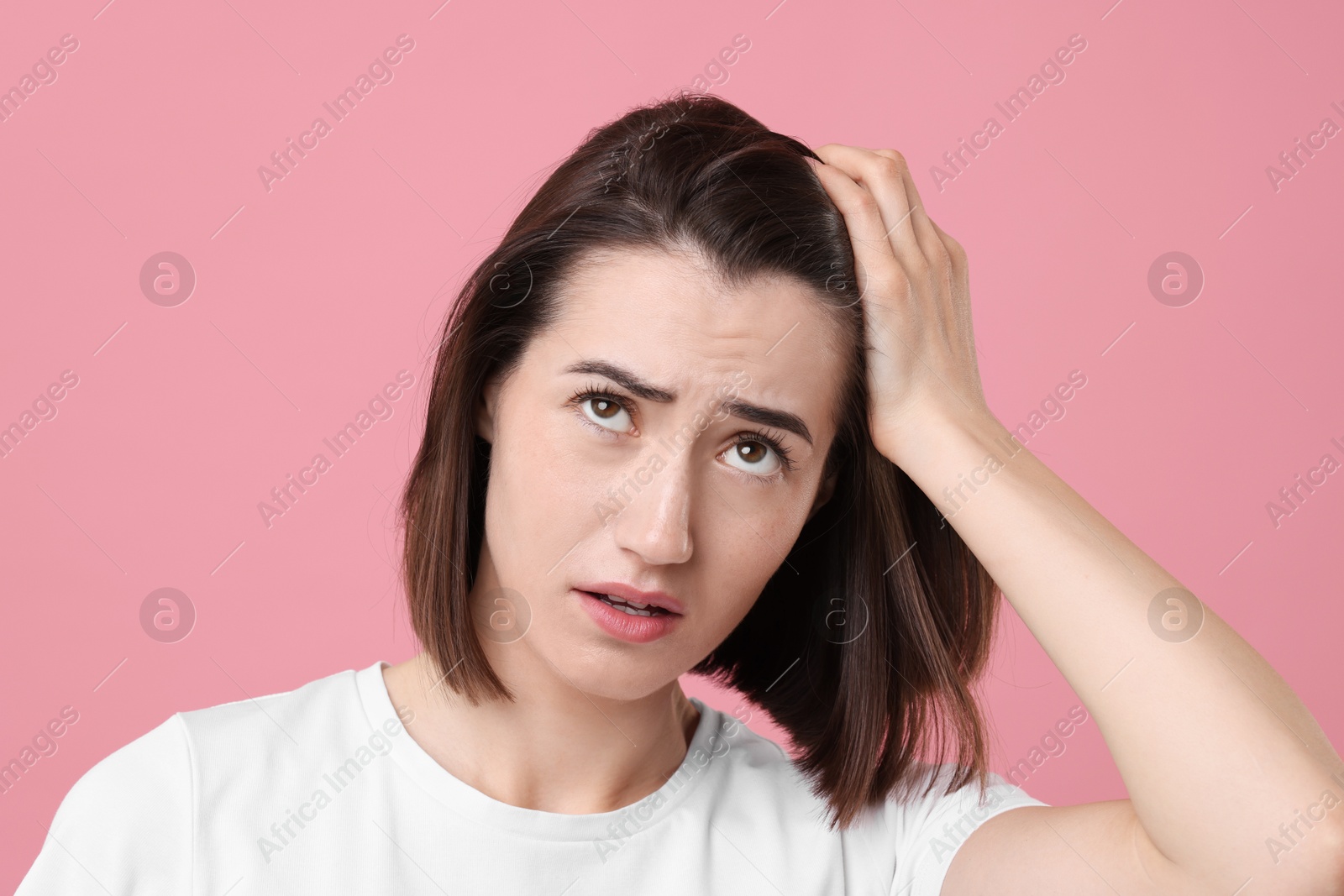 Photo of Sad woman with hair loss problem on pink background