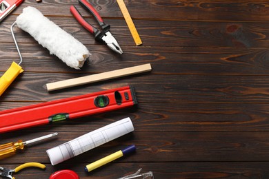 Photo of Flat lay composition with building level and other construction tools on wooden table, space for text