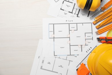 Photo of Flat lay composition with building level and other construction tools on white wooden table, space for text