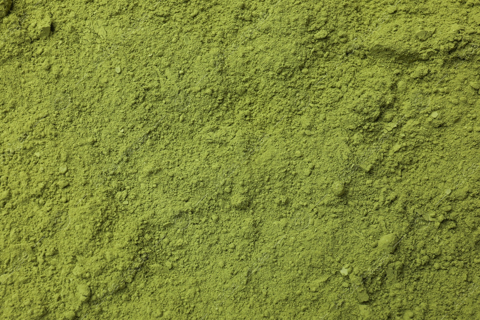 Photo of Green matcha powder as background, top view