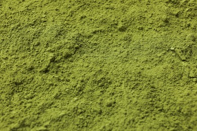 Photo of Green matcha powder as background, closeup view