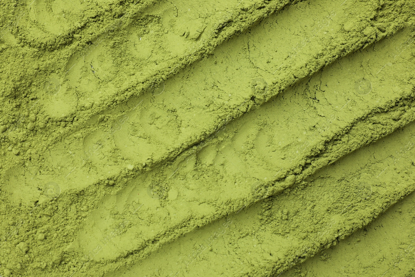 Photo of Green matcha powder as background, top view