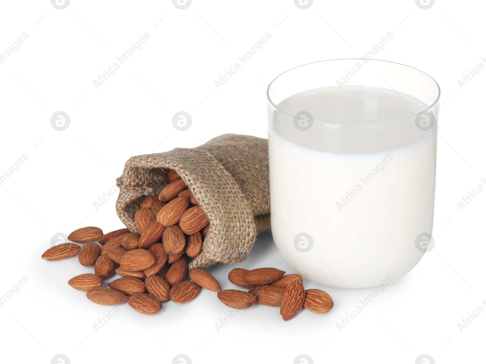 Photo of Glass of almond milk and almonds isolated on white