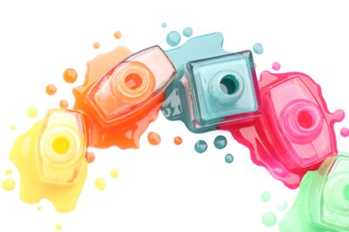 Many bottles and drops of colorful nail polishes isolated on white, top view