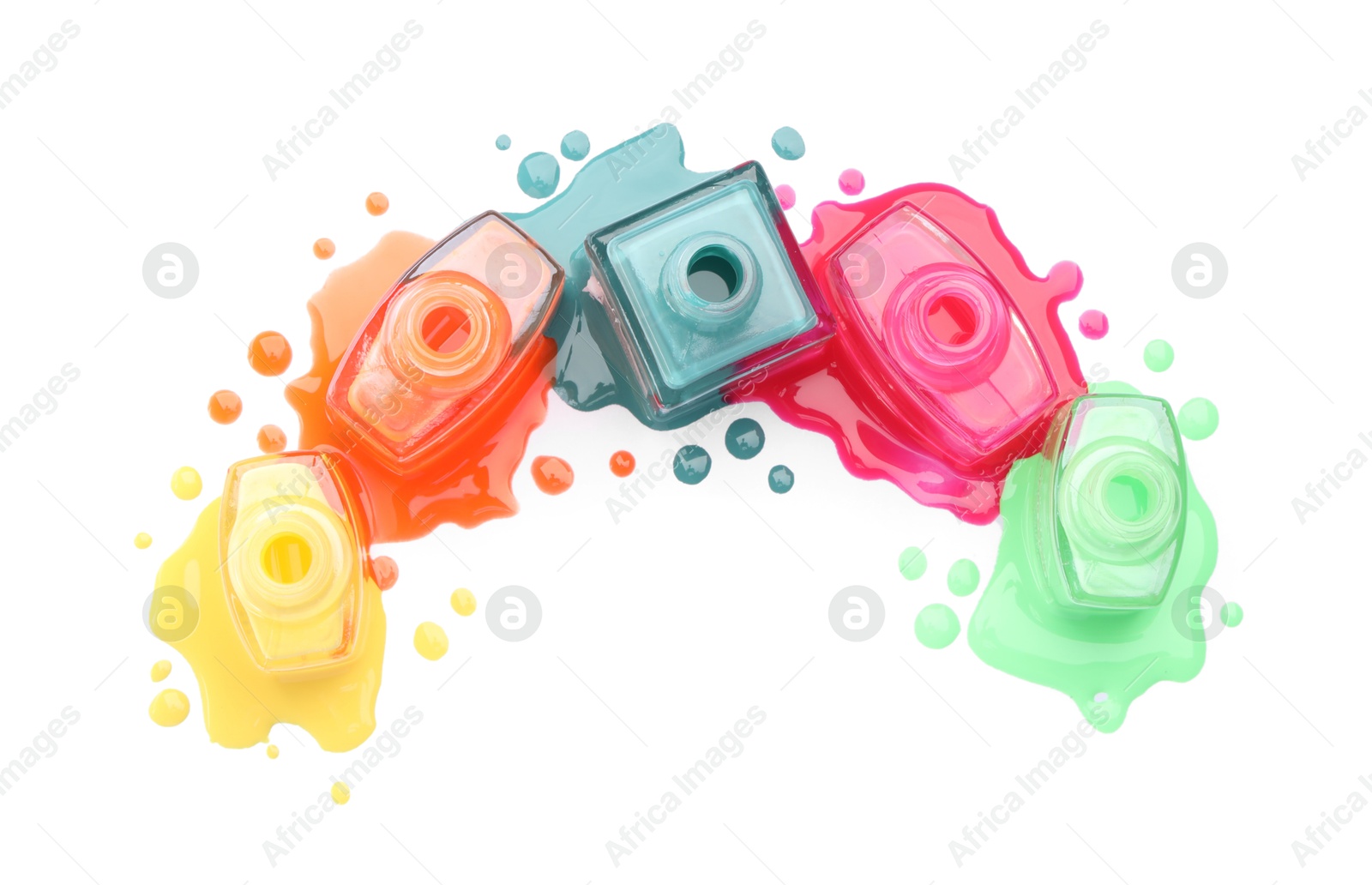 Photo of Many bottles and drops of colorful nail polishes isolated on white, top view