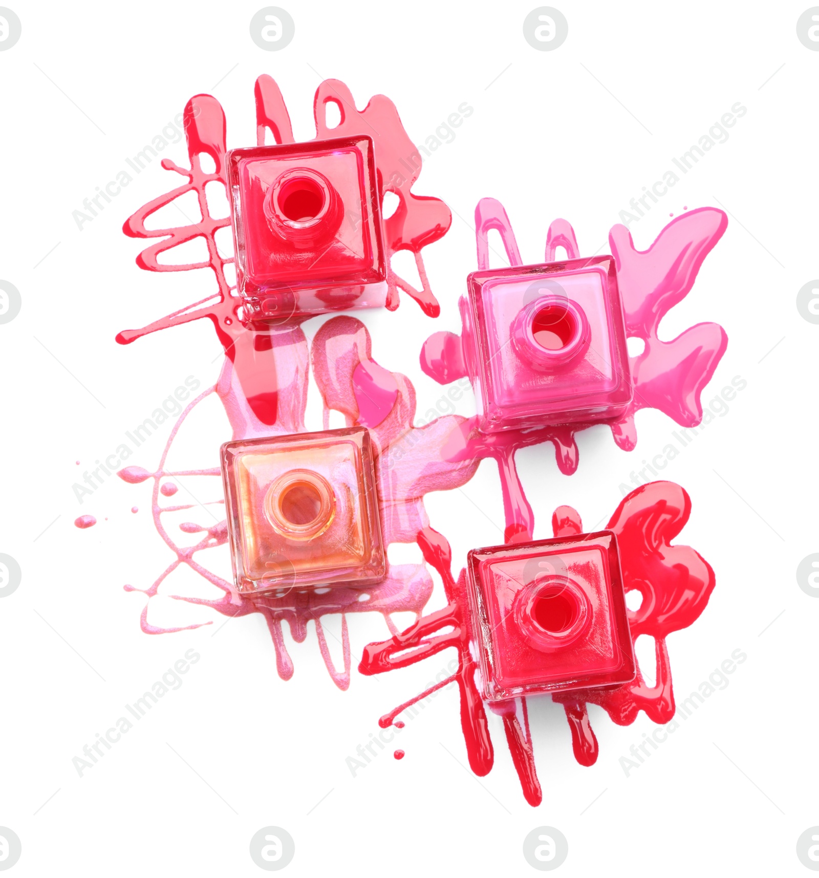 Photo of Many bottles and spilled nail polishes isolated on white, top view