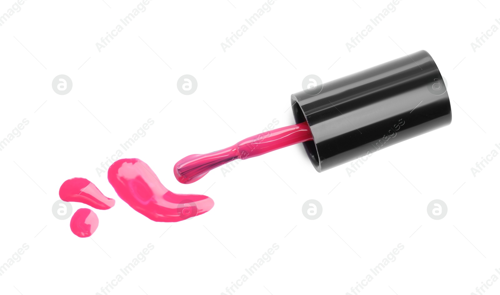 Photo of Brush and spilled pink nail polish isolated on white, top view