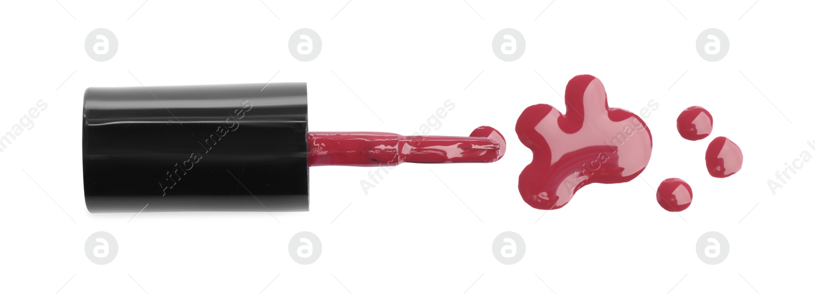 Photo of Brush and spilled red nail polish isolated on white, top view