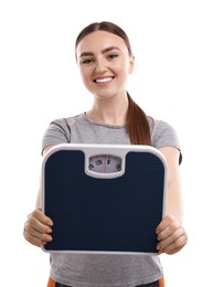 Happy woman with floor scale on white background