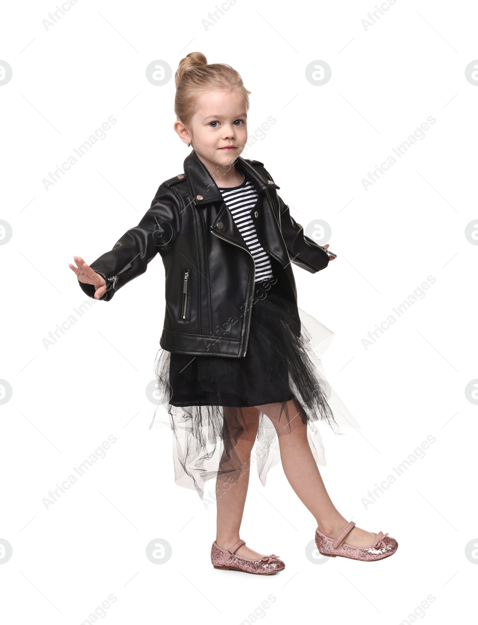 Photo of Cute little girl dancing on white background