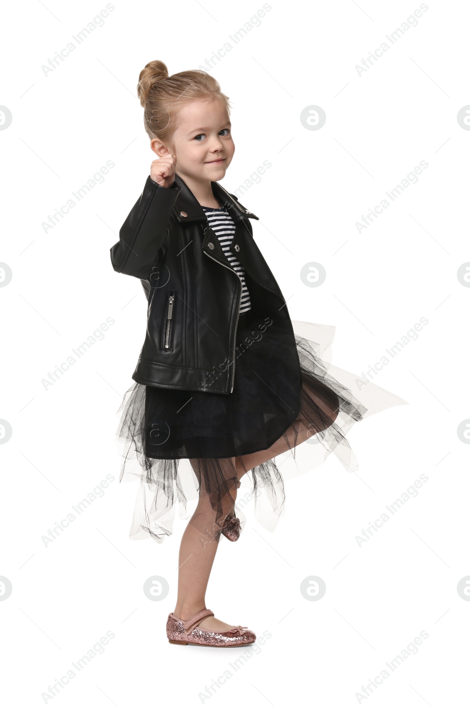 Photo of Cute little girl dancing on white background