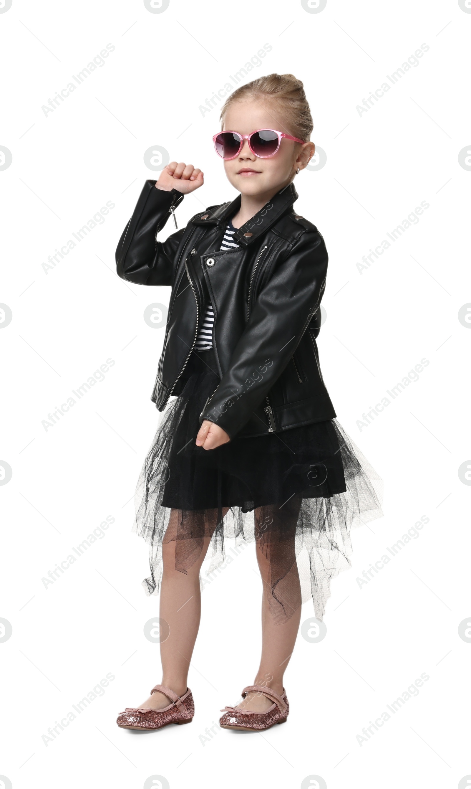 Photo of Cute little girl in sunglasses dancing on white background