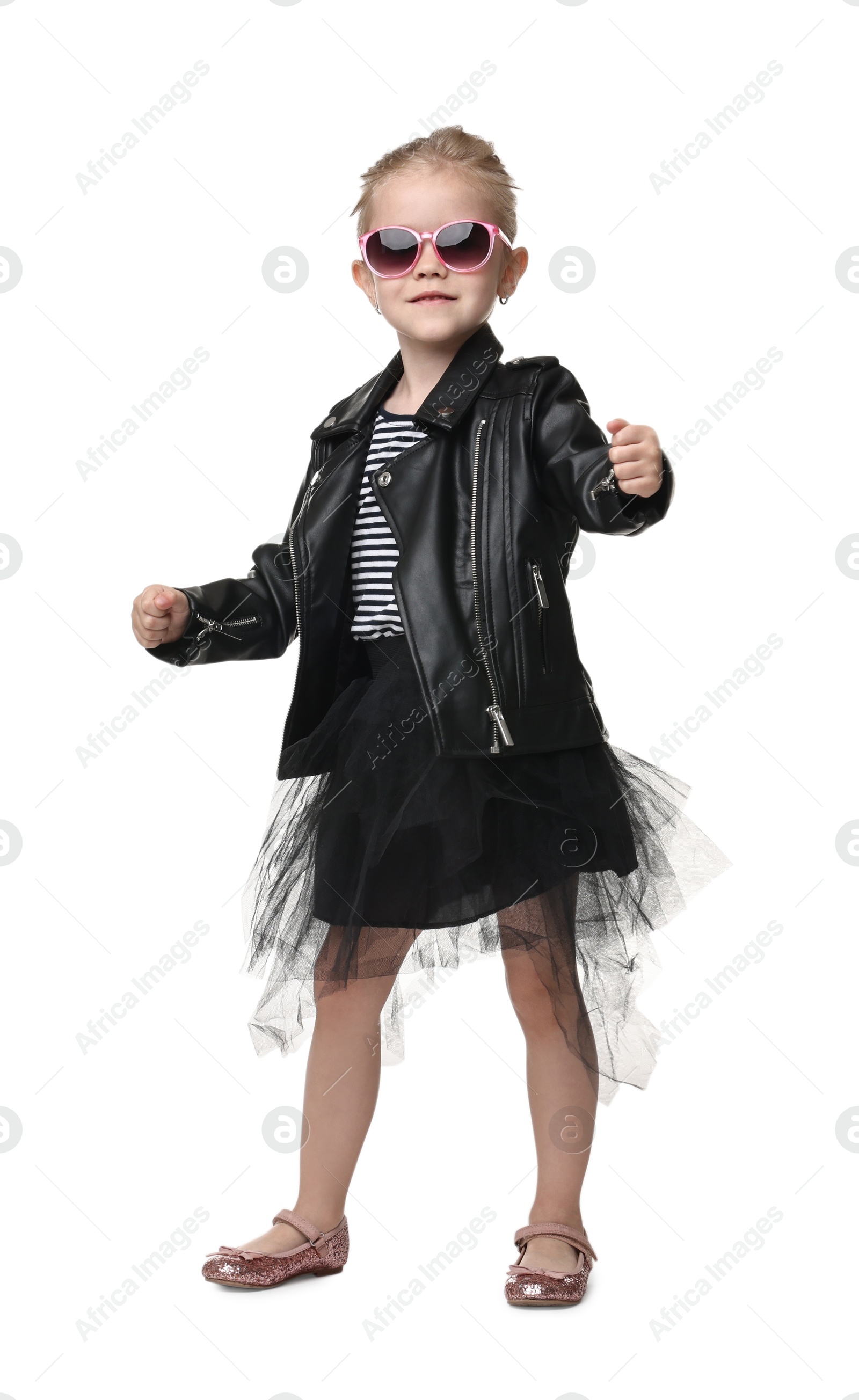 Photo of Cute little girl in sunglasses dancing on white background