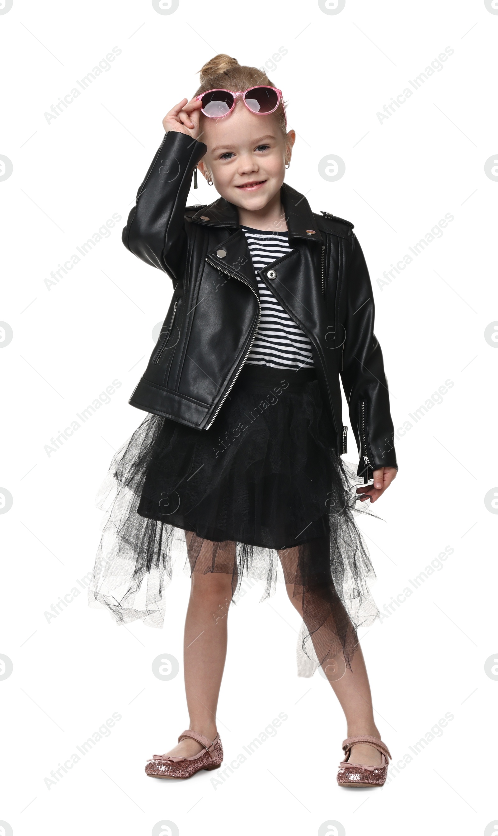 Photo of Cute little girl with sunglasses dancing on white background