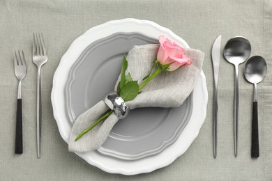 Photo of Stylish setting with cutlery and plates on table, flat lay