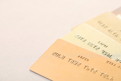 Photo of Many credit cards on gray background, closeup. Space for text