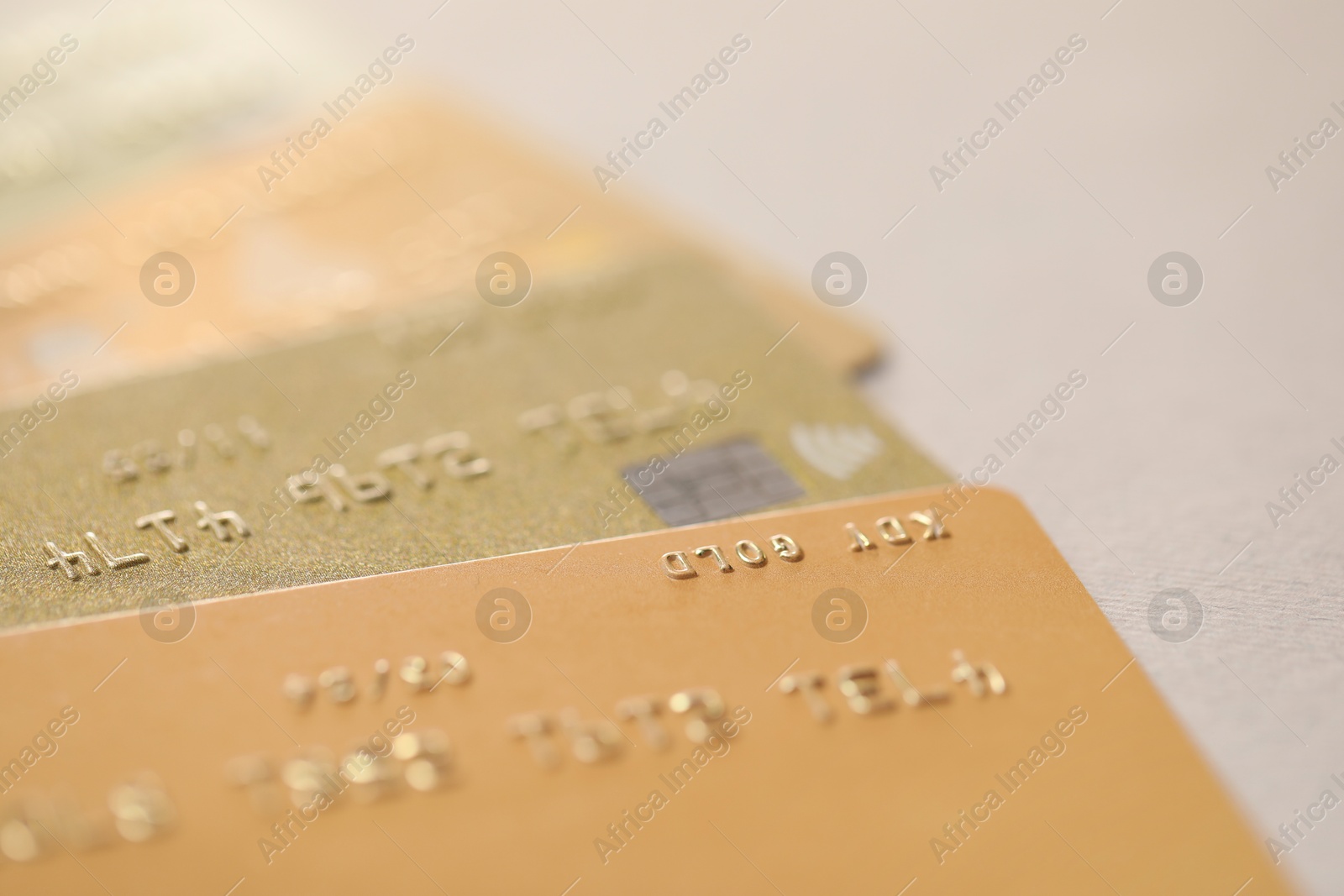 Photo of Many credit cards on gray background, closeup