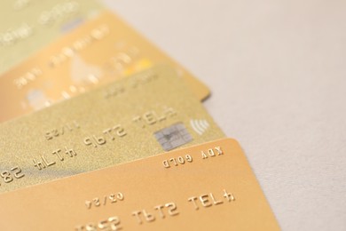 Photo of Many credit cards on gray background, closeup